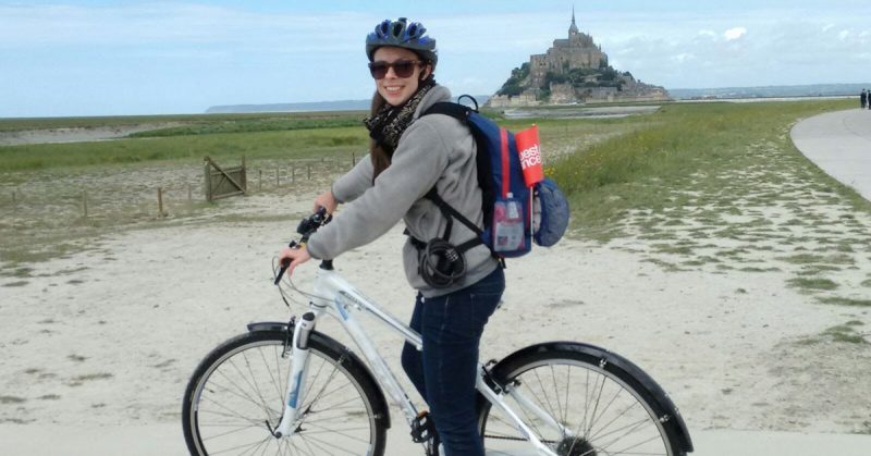 chelsea georgesen on a bike smiling