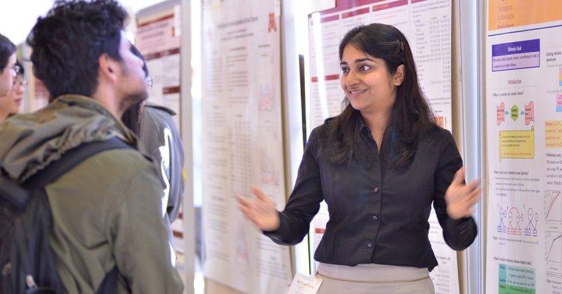 debashree ray presenting at a poster session