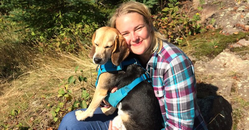 Holly Magdanz smiling with her dog