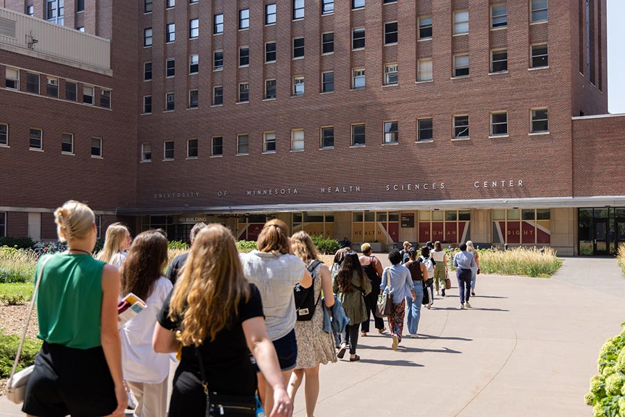 Students walking into the mayo building